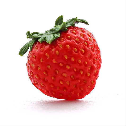 Half a large red strawberry, with yellow seeds clearly depicted, is affixed to a silver-coloured ring base. The ring is set against a white background.